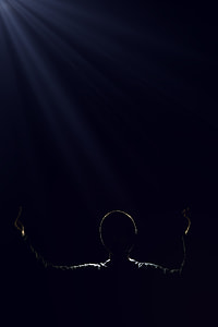 silhouette of a person raising his/her both hands thumbnail