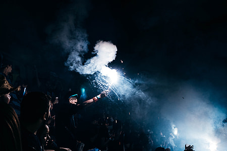 person raising white flare with smoke thumbnail
