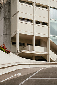white concrete building near road thumbnail