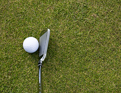 gray stainless steel golf drive near golf ball on grass field at daytime thumbnail