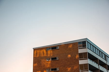 brown and white concrete buildings thumbnail