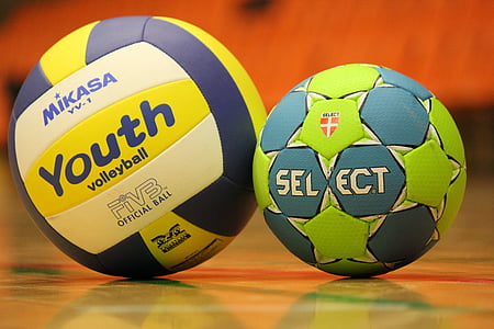 soccer ball beside volleyball on floor thumbnail