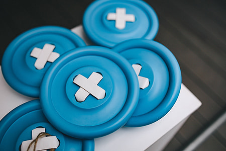 Close-ups of big blue plastic buttons thumbnail