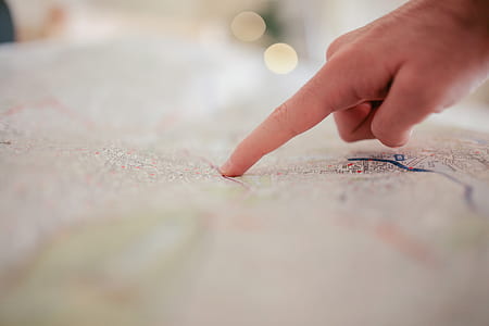 hand pointing on map thumbnail