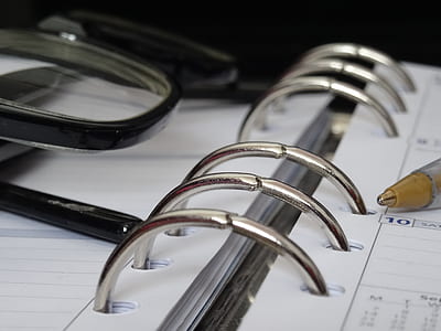 black framed eyeglasses on spring notebook thumbnail