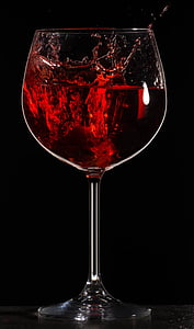 clear wine glass filled with red liquid thumbnail
