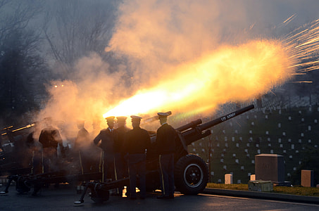 men firing canon during twilight thumbnail