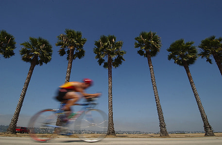 man in yellow top riding on mountain bicycle thumbnail