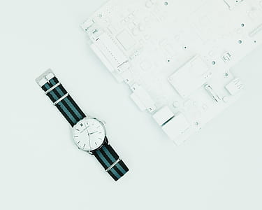 round silver-colored analog watch with striped strap thumbnail
