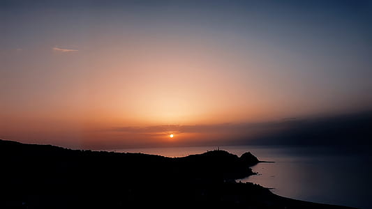 silhouette of mountain during sunset thumbnail