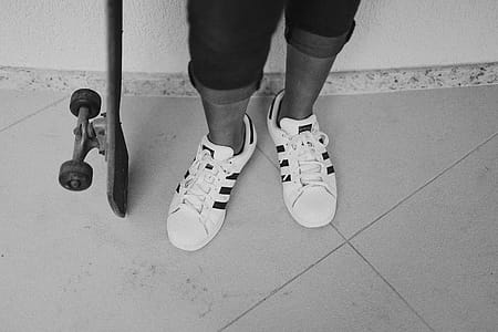 Grayscale Photography Of Person Wearing Adidas Shoes thumbnail