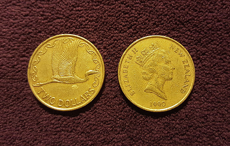 two yellow round gold-colored coins thumbnail