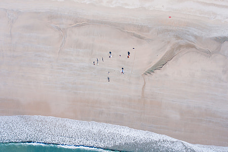 aerial photography of land near the sea thumbnail