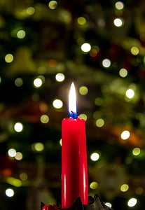 bokeh photography of lighted red candlestick thumbnail
