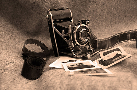 shallow focus photography of land camera surrounded by pictures thumbnail