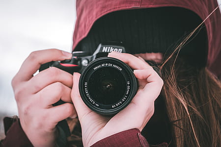 woman taking a photo using Nikon camera thumbnail