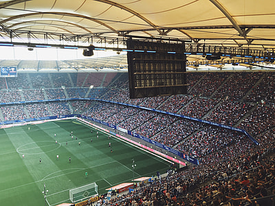 people watching soccer game at the stadium thumbnail