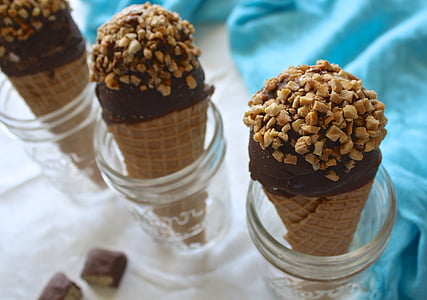 three chocolate ice creams in clear glass containers thumbnail