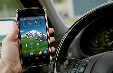 person holding black turned-on Android smartphone thumbnail