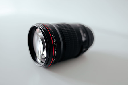 black DSLR camera lens thumbnail