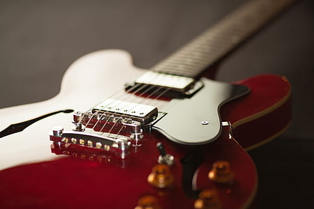 shallow focus photo of red telecaster electric guitar thumbnail