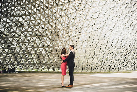couple standing near glass dome thumbnail