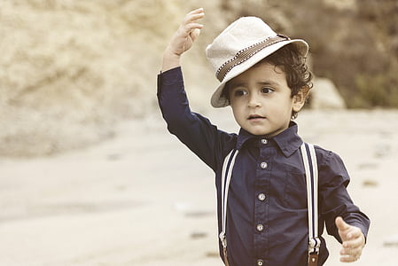 boy in black dress shirt with suspender and hat thumbnail