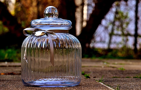 closeup photography of clear glass candy dish with lid thumbnail