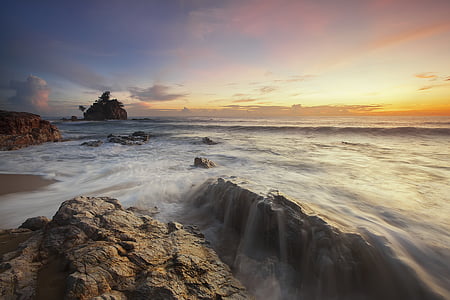 ocean waves and brown stones thumbnail