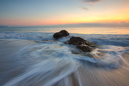 gray rocks near seashore thumbnail