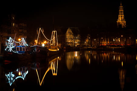 city buildings near body of water during nighttime thumbnail
