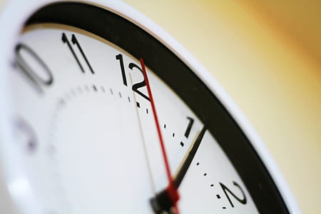 round analog wall clock on wall thumbnail