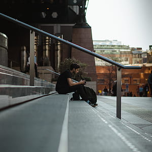 man sitting on stair thumbnail