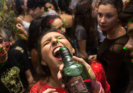 Woman Wearing Red Shirt Drinking thumbnail