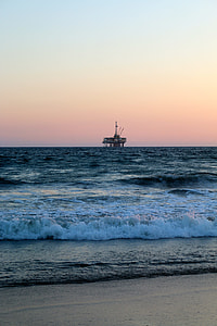 gray concrete fuel collector on body of water thumbnail