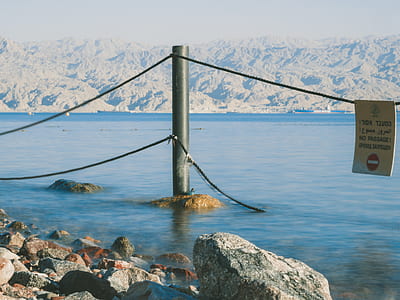 metal post in body of water thumbnail