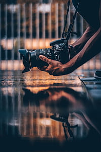 shallow focus photography of person taking a photo thumbnail