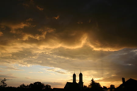 silhouette of trees and concrete structures during sunset thumbnail