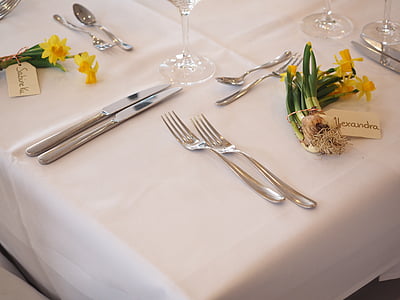 silver cutlery on white table cloth thumbnail