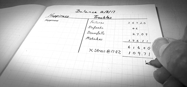 person writing on printer paper thumbnail