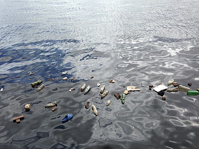 aerial view photography of garbages floating above body of water thumbnail