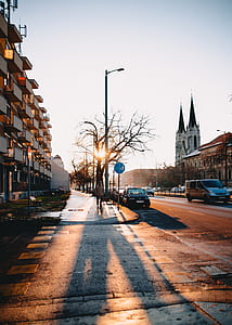silhouette photo of person walking along the alley thumbnail