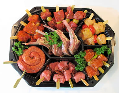 raw meats on black cooking pot thumbnail