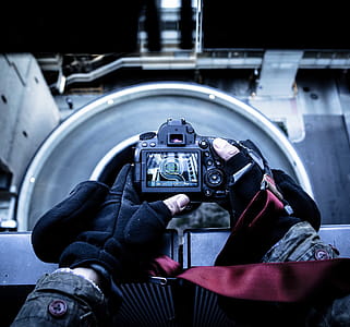 Person Holding Black Dslr Camera thumbnail