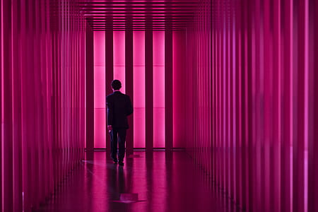 man walking to the pink hallway thumbnail