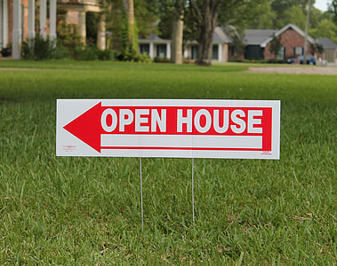 red and white Open House signage on grass thumbnail