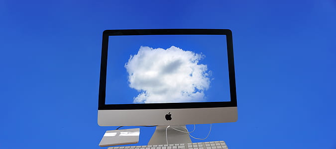 silver iMac monitor displaying clouds thumbnail