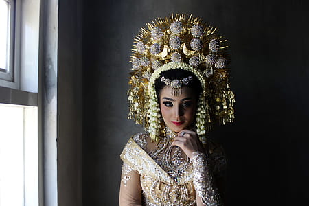 Woman Wearing Gold Headdress And Top thumbnail