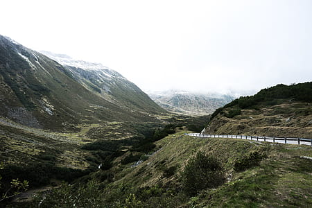 clear paved road near cliff thumbnail