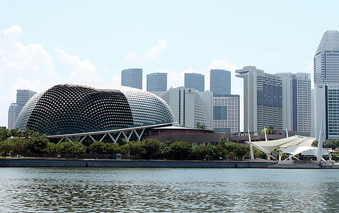 photo of architectural building near high-rise buildings during daytime thumbnail